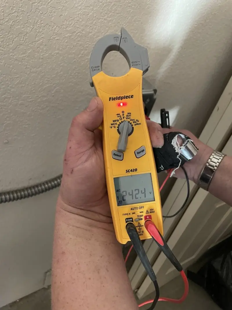 Voltage testing with clamp meter during Generator Installation in Port Isabel